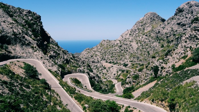 Serpentine mountain road overlooking the sea