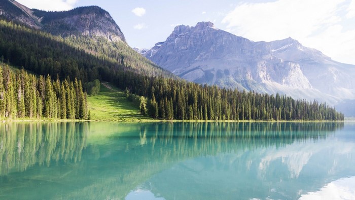 Emerald Lake with Mountains and Forest Reflection