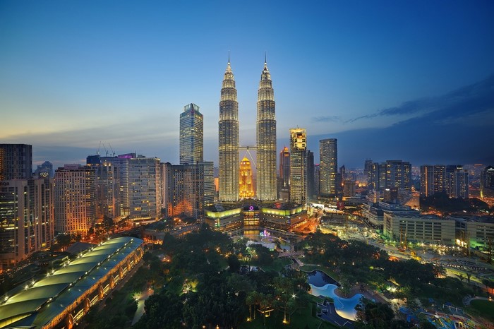 Petronas Twin Towers and Kuala Lumpur cityscape at dusk