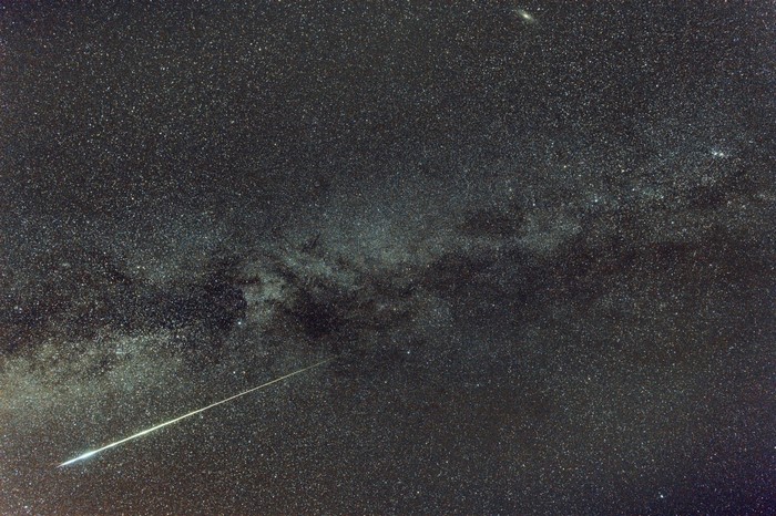 Meteor shower over the Milky Way galaxy