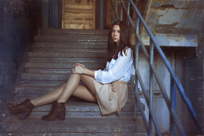 Woman Sitting on Staircase Wearing Fashion Outfit