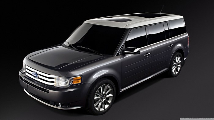 Dark gray Ford Flex crossover SUV with a white roof