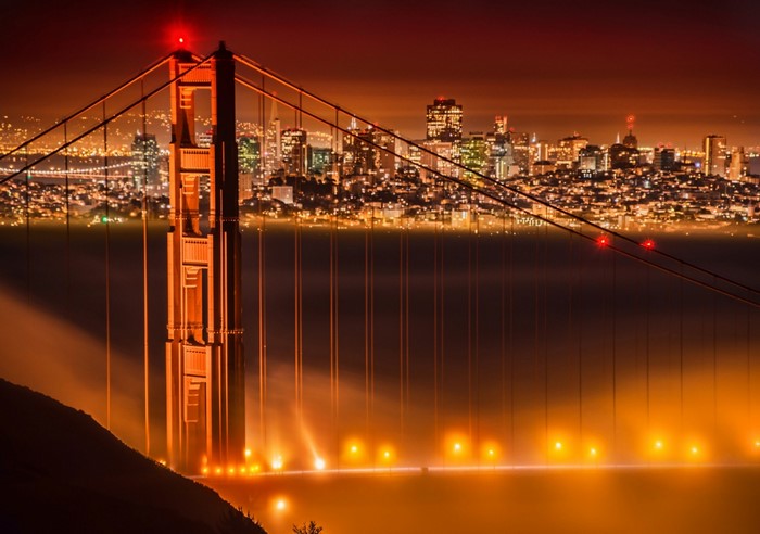 Golden Gate Bridge at night with San Francisco skyline