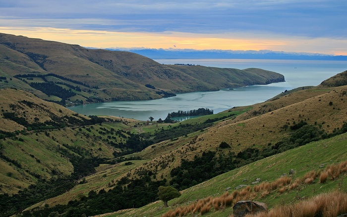 Hills overlooking a bay at sunset