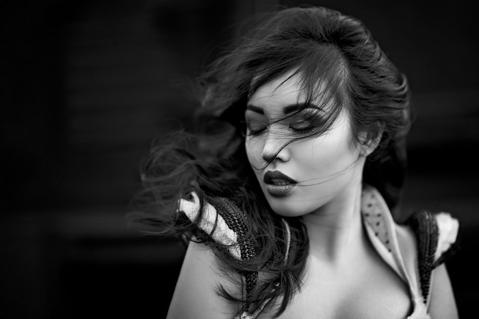 Monochrome portrait of a woman with windblown hair