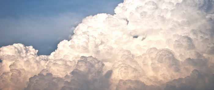 Cumulus clouds in the sky with sunlight