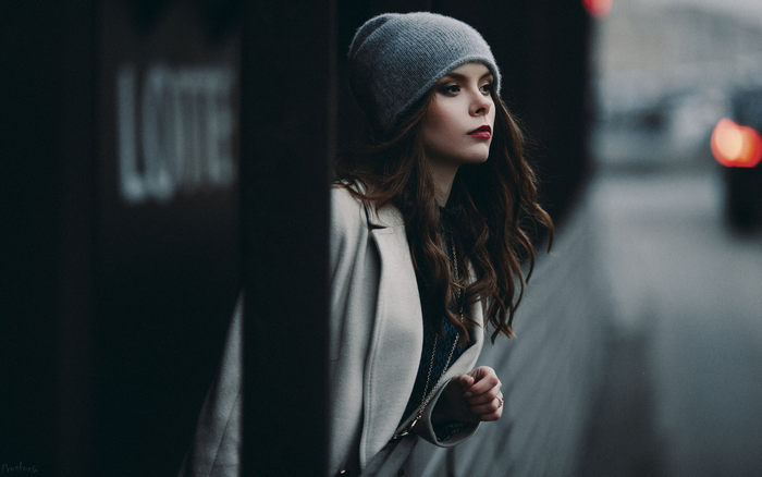 Woman in a gray beanie and coat