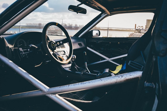 Interior of a modified drift car with roll cage