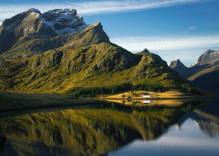 Mountain landscape with a lake and a house