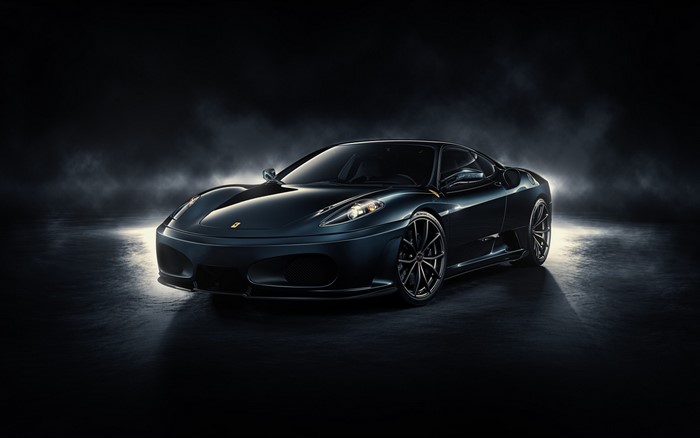 Dark Ferrari F430 sports car on a dark background