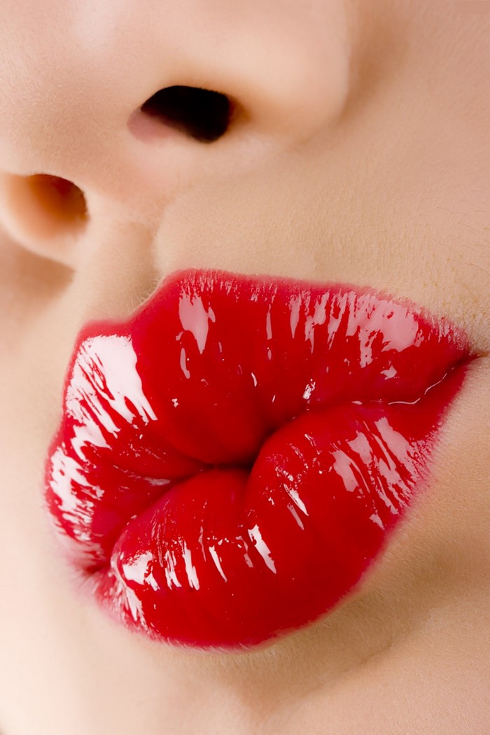Close up of red glossy lips and nose