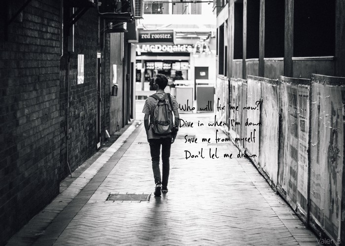 Man walking down alley with Bring Me the Horizon lyrics
