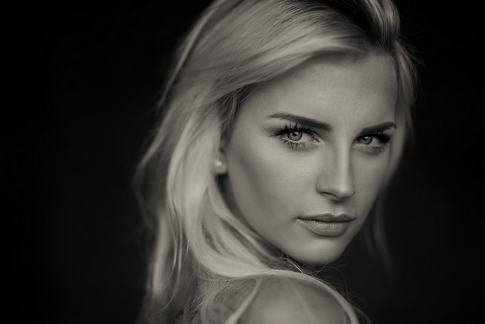 Monochrome Portrait of a Blonde Woman with Sensual Gaze