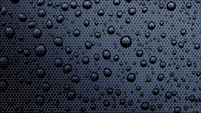 Water drops on a dark perforated surface