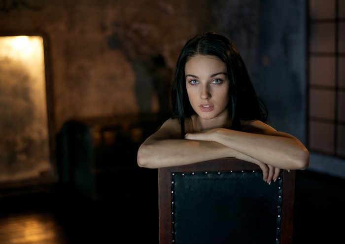 Woman sitting on a chair, portrait photography