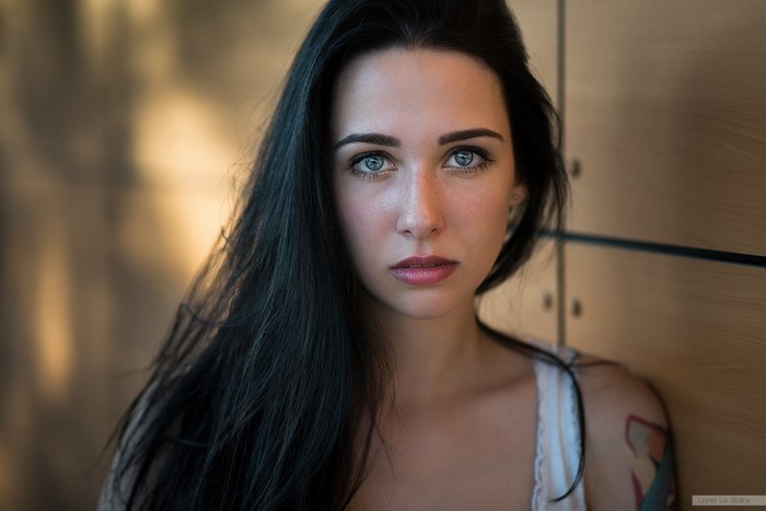 Woman with black hair and blue eyes, portrait