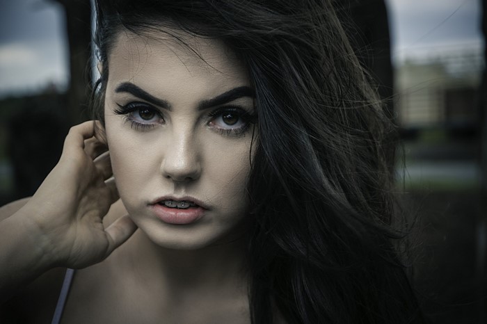 Close-up portrait of a young woman with dark hair