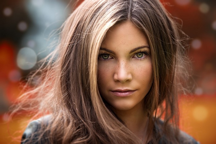 Close-up Portrait of Woman with Green Eyes and Freckles