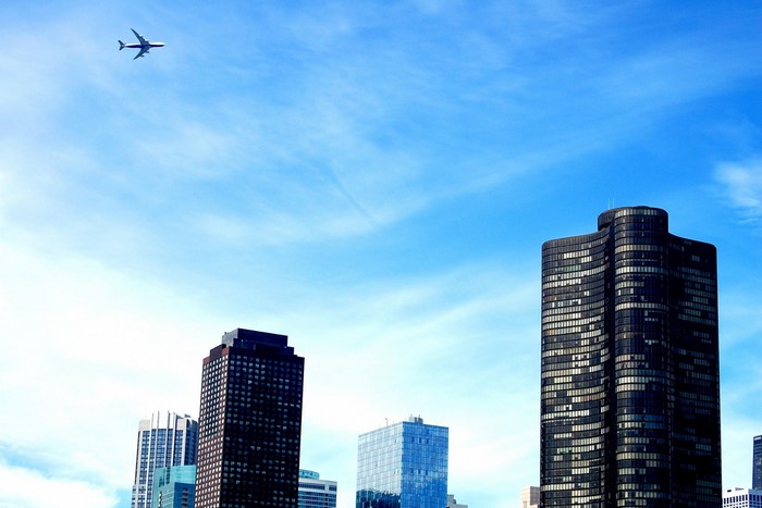 Airplane flying over Chicago skyscrapers