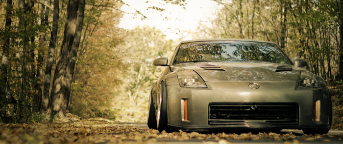 Nissan 350Z sports car on a forest road
