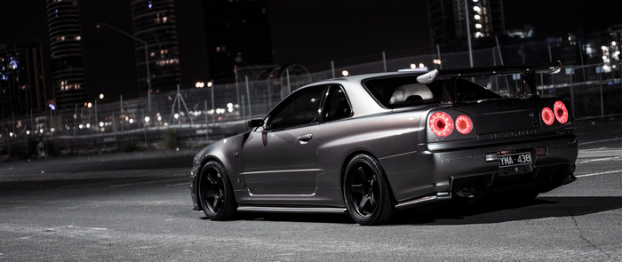 Nissan Skyline GT-R R34 parked at night