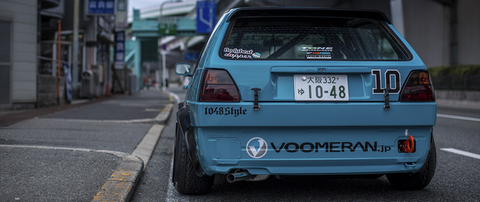 Blue Volkswagen Golf GTI with custom decals
