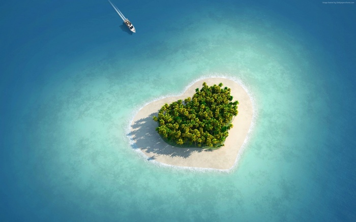 Heart-shaped island in the ocean with a boat