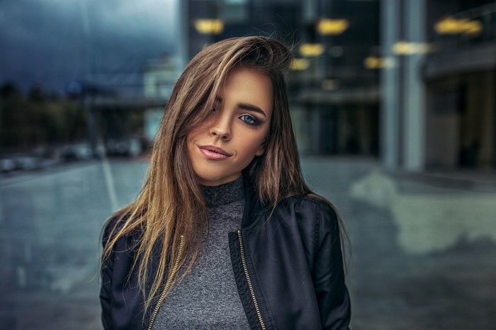 Woman with long brown hair and blue eyes