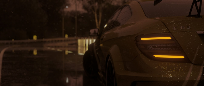 Mercedes-Benz C63 Coupe on a wet road at night