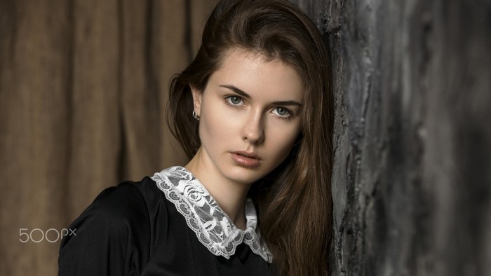 Portrait of a young woman with long brown hair