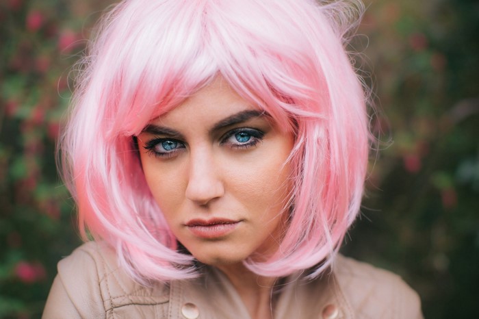 Woman with pink wig and blue eyes