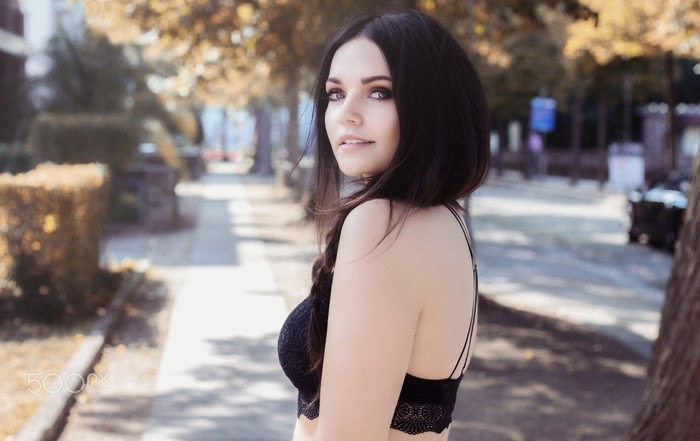 Brunette Woman in Black Top Outdoors