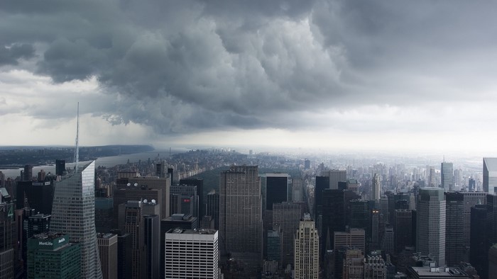 New York City skyline under stormy clouds