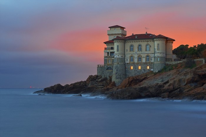 Castello del Boccale on a rocky coast at sunset