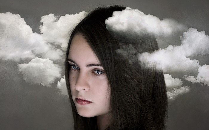 Woman with clouds in her hair