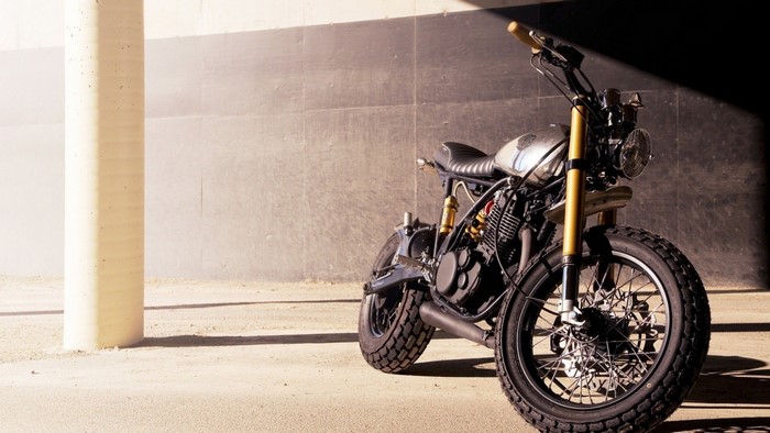 Custom cafe racer motorcycle parked outdoors