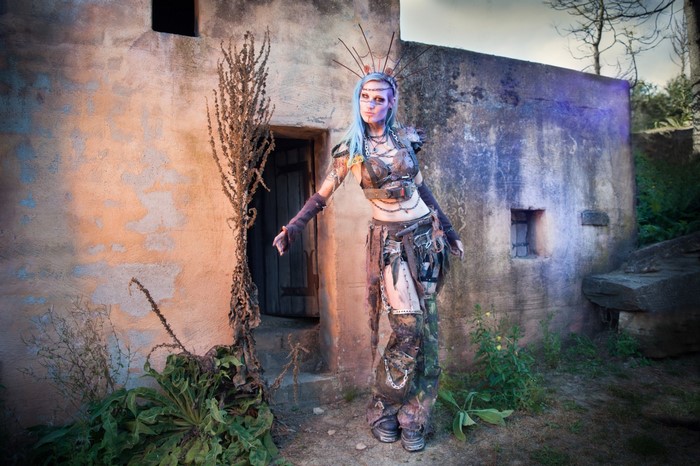 Woman in post-apocalyptic cosplay with blue hair