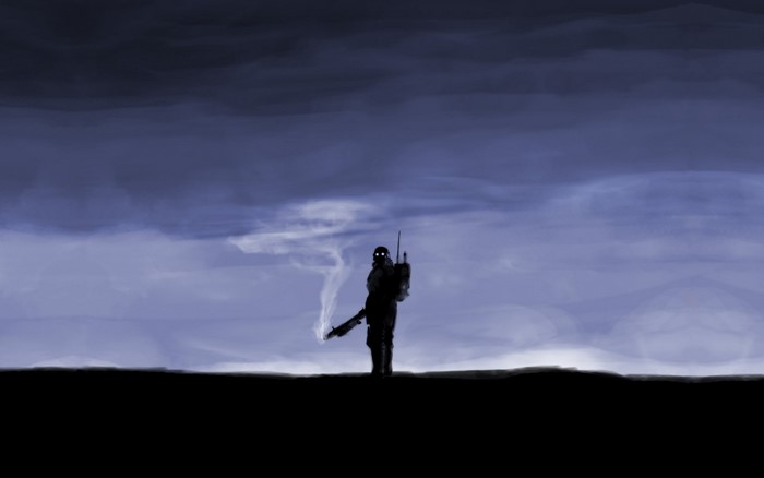 Silhouette of a soldier with a rifle against a cloudy sky