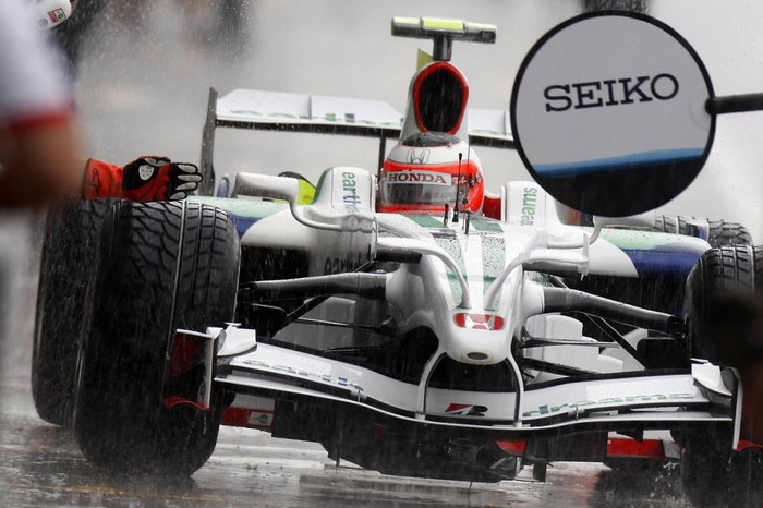 Formula 1 race car with SEIKO logo in the rain