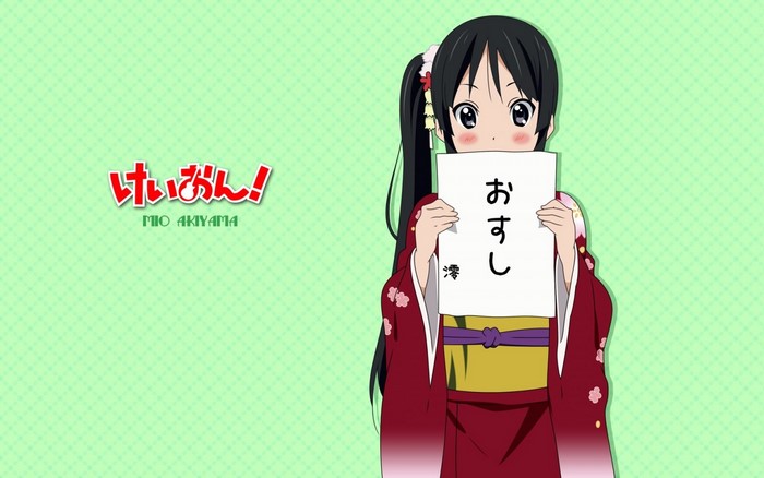 Mio Akiyama from K-ON! holding a sign