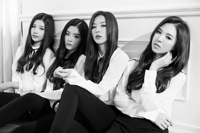 Four women in white shirts and black pants