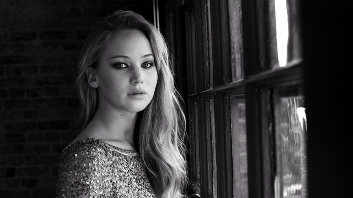 Jennifer Lawrence in monochrome portrait by a window