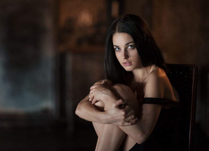 Thoughtful Woman in Soft Light Embrace