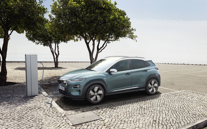 Hyundai Kona Electric charging at a charging station