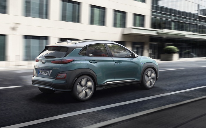 Hyundai Kona Electric driving on a city street