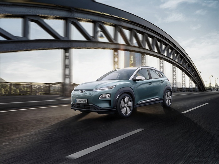 Hyundai Kona Electric driving on a bridge