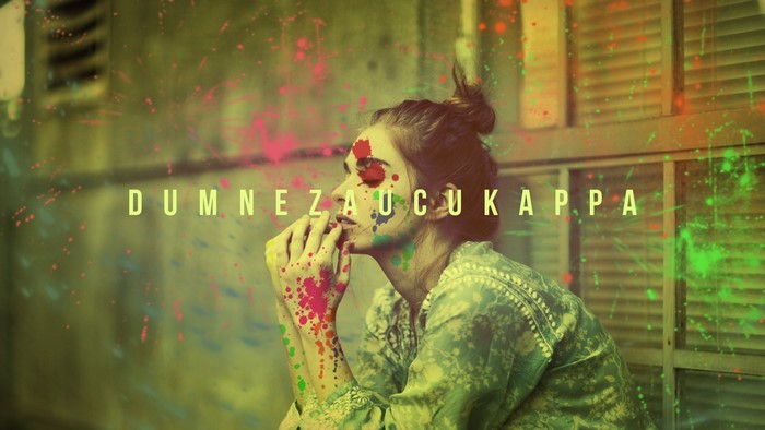 Woman with paint splatters and text