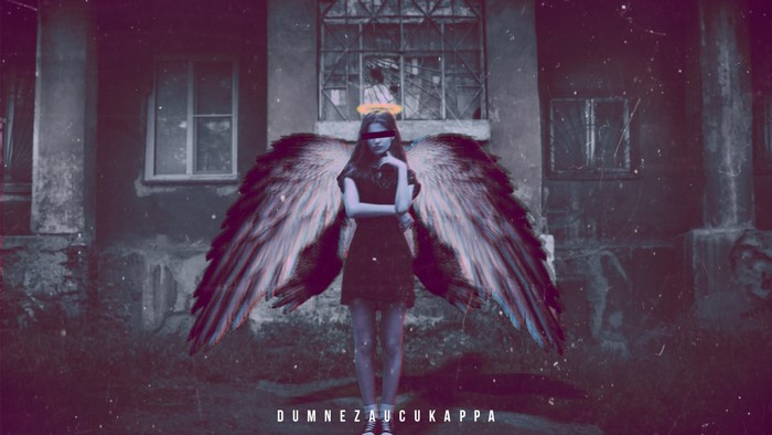 Angel with wings in front of a building