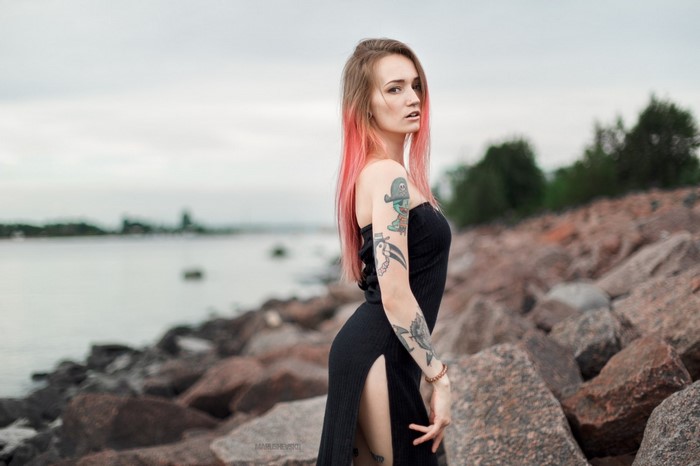 Woman with Tattoos and Dyed Hair by the Sea