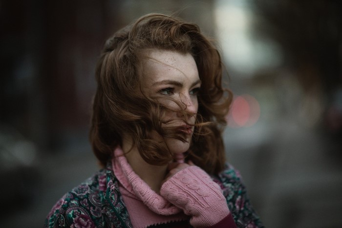 Woman with red hair in the wind